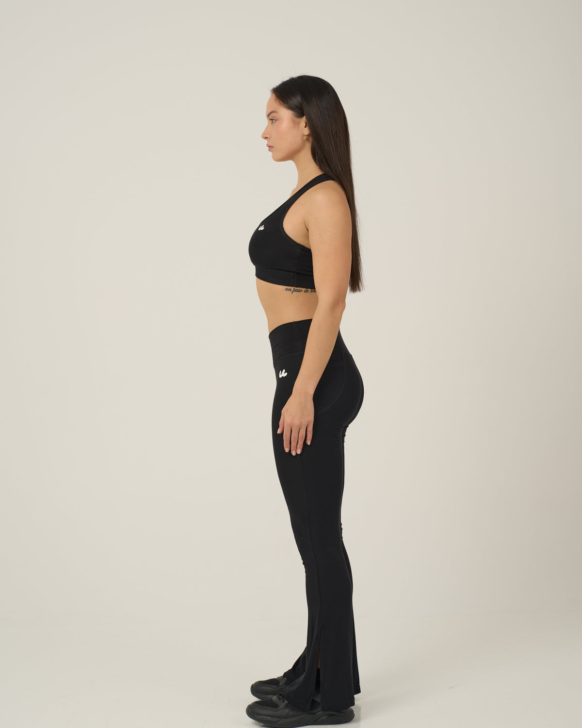 Side view of the Urthlete bamboo flare leggings in coal black