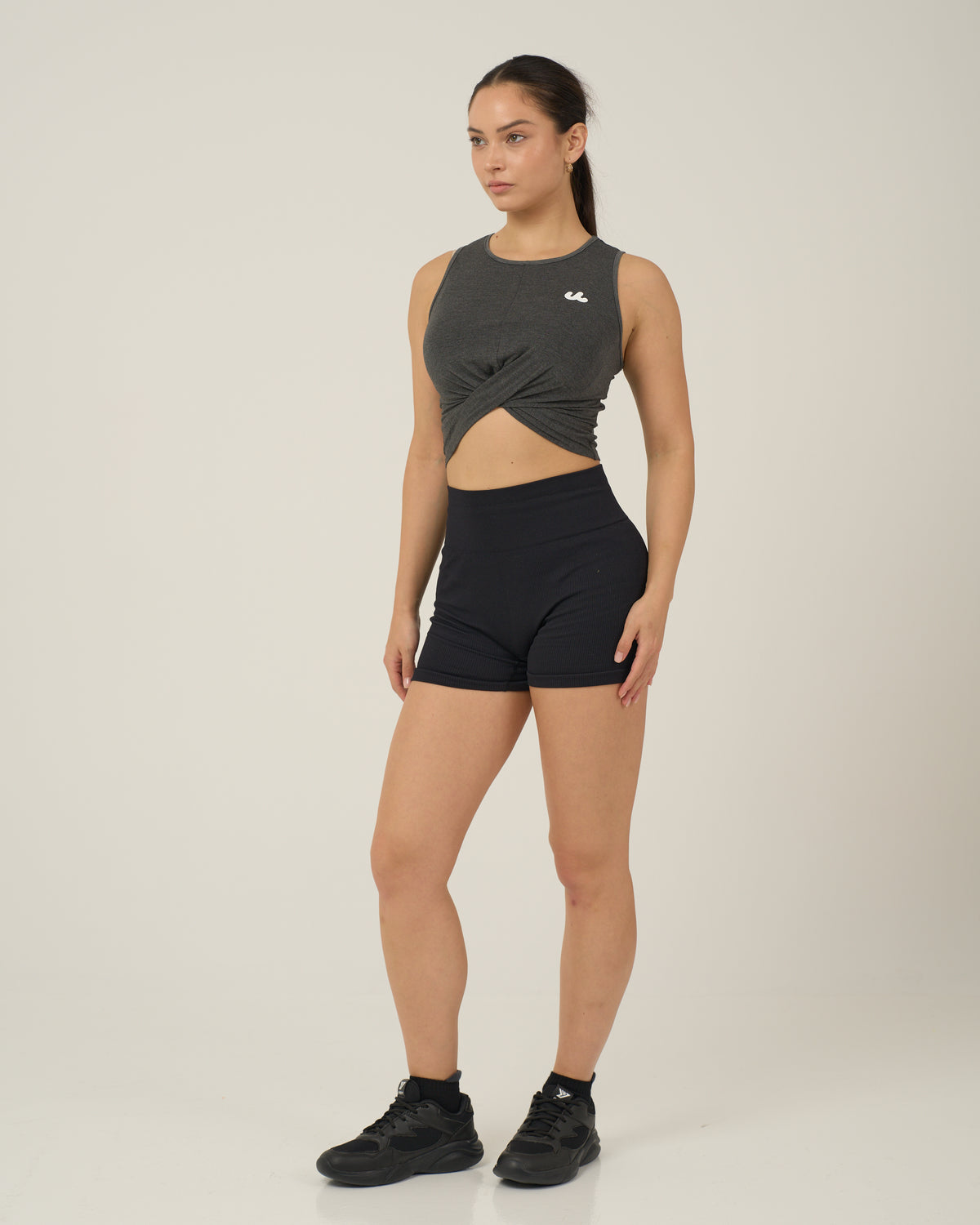 Woman in the Urthlete bamboo fitted tank in slate gray, full length front view