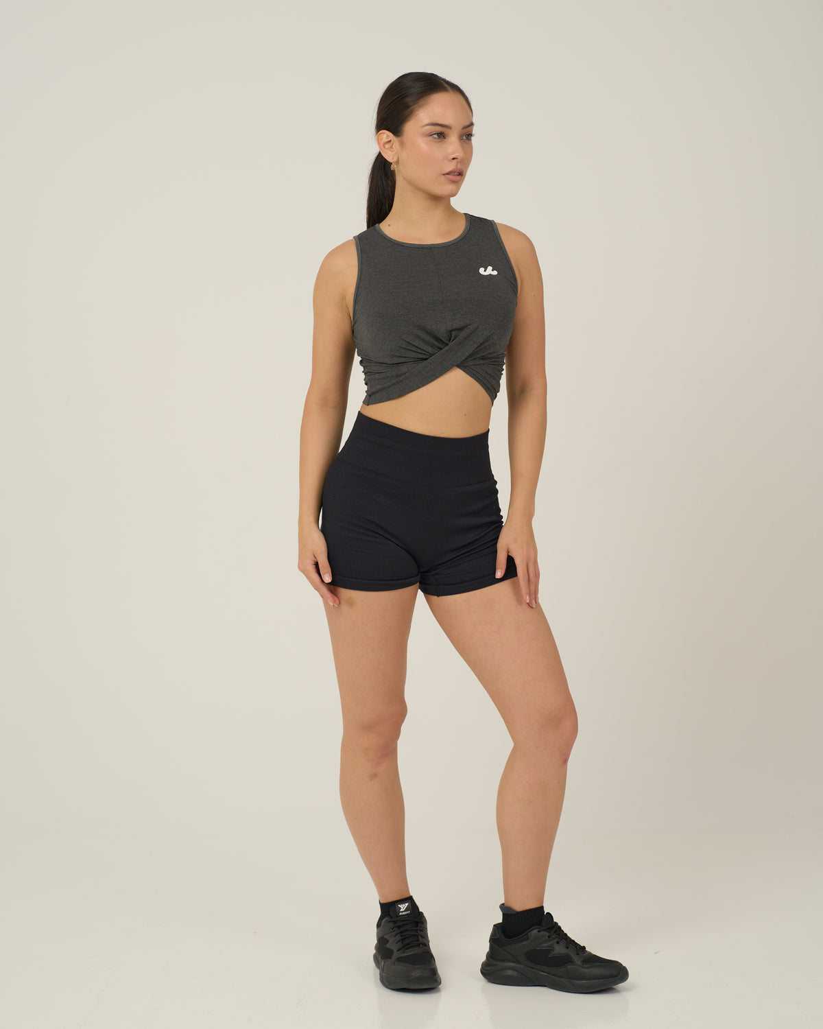 Urthlete bamboo fitted tank in slate gray worn with black shorts